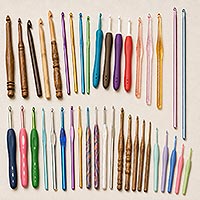 A variety of crochet hooks in different sizes, lengths, and styles.